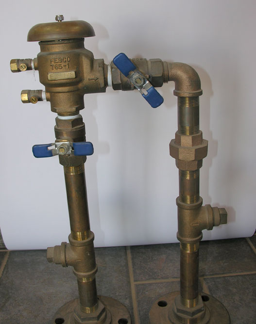 Figure 3a: Left Photo: Pressure vacuum backflow device (PVB)