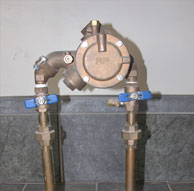 Right Photo – Reduced Pressure back flow device (RP). Blue handles designate