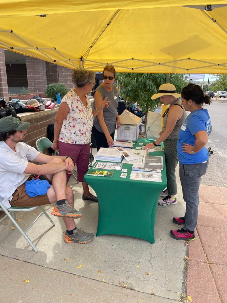 Boulder Master Gardeners assisting community members at an information/ask table