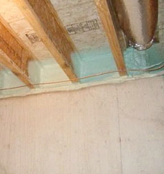 Figure 2. Spray foam seals leaks between floor joists and the foundation.