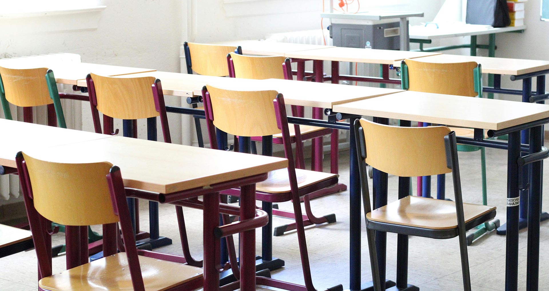 A school classroom with empty desks