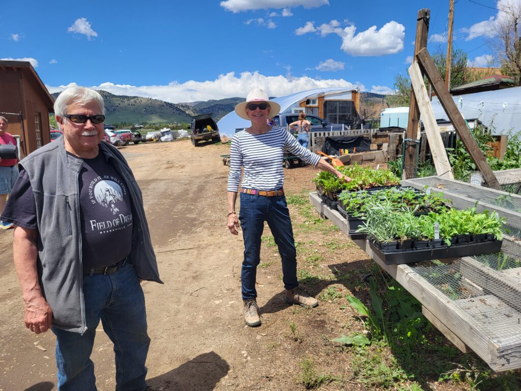 Two Gilpin County Master Gardeners standing next to an outdoor garden.