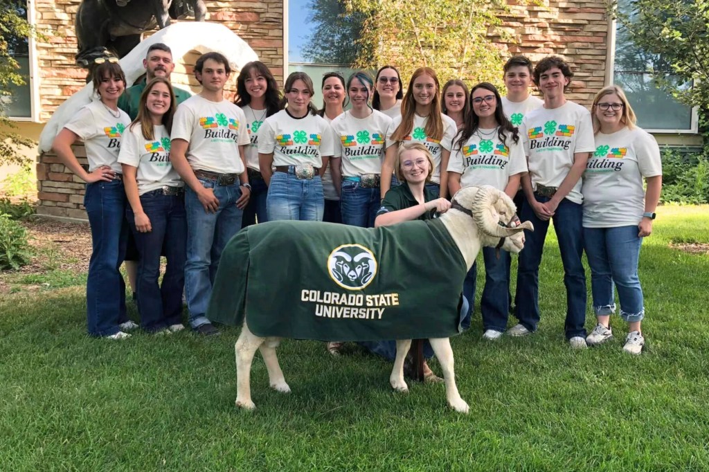 A group of 4-H youth pose with CAM the Ram