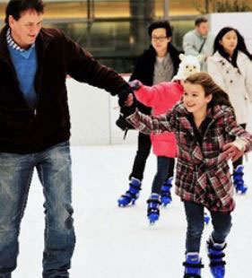 father and daughter ice skating