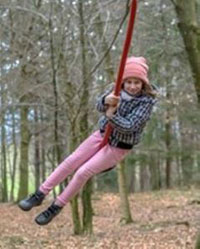 child on rope swing