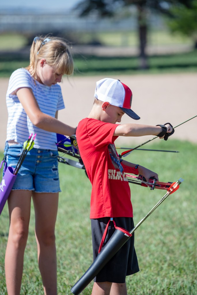 Cora Paris (left) and Greyson Thomas (right) on the line. (photo credit to Dustin Price Photography)