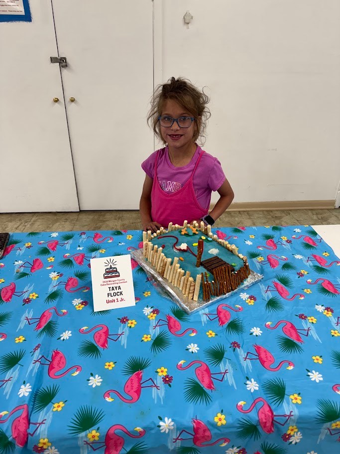 Taya Flock with a beach themed cake