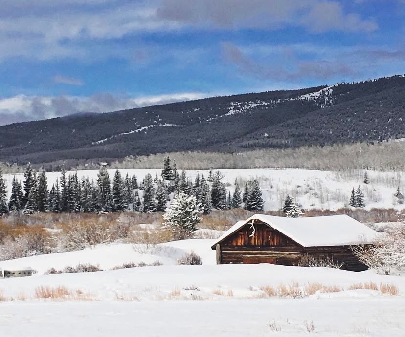 a small cabin in a snow covered field in Park County, Colorado