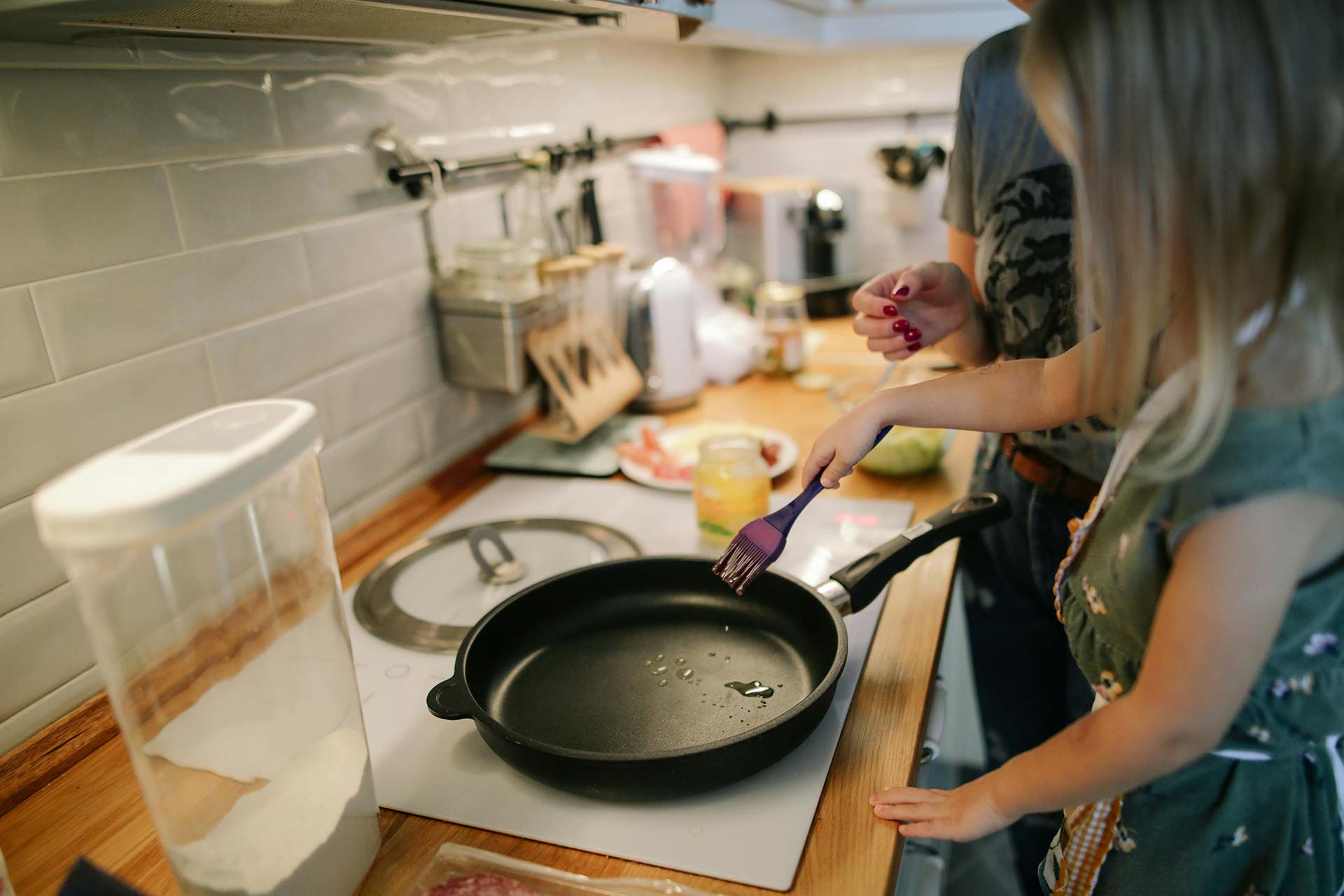 A person cooking in their home kitchen