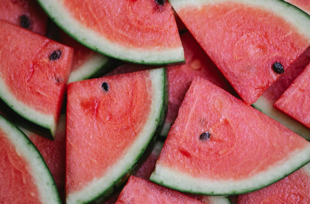 Close up of multiple slices of watermelon.