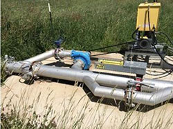 Irrigation water diverted to a turbine before being used to irrigate.