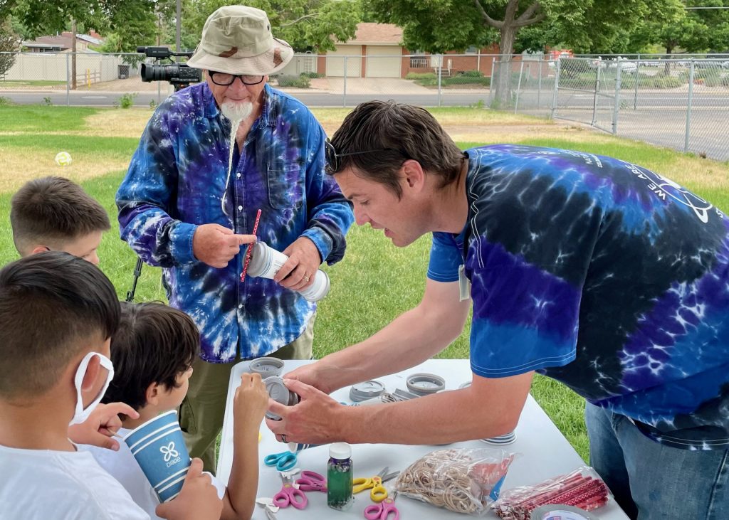Patrick Pulis (right) and Patrick Lindsell (left) teach kids about energy transformations with coffee cup racers!
