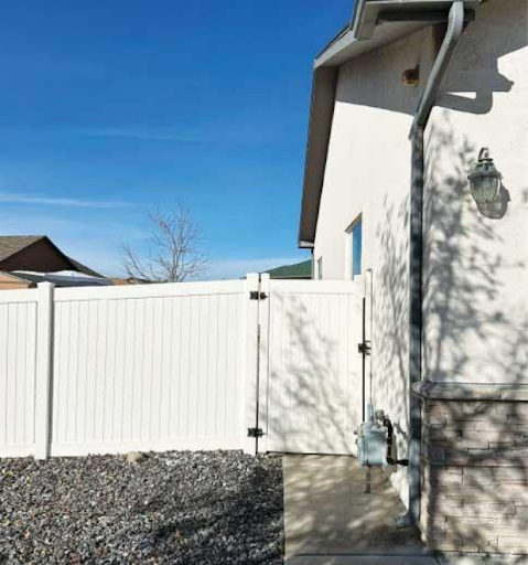 Example of a non-combustible fence made of vinyl attached to a house. 