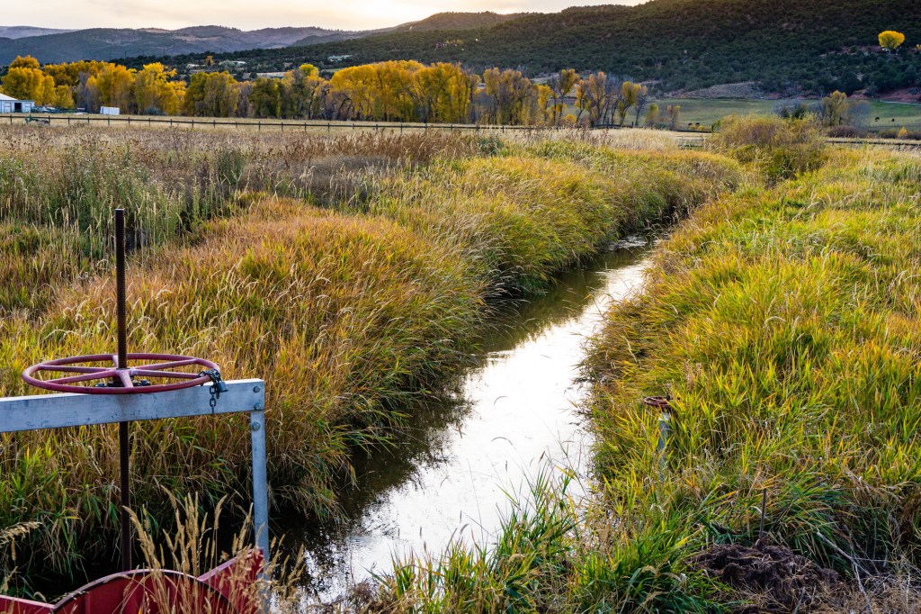 an irrigation ditch with water flowing