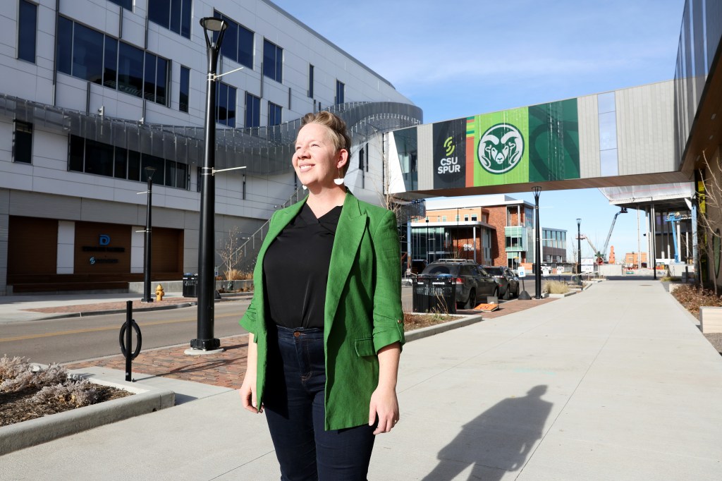 Jordan Lambert poses in front of the CSU Spur building